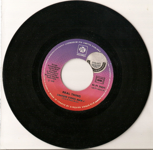 The Real Thing -Lightning Strikes Again / Dance With Me